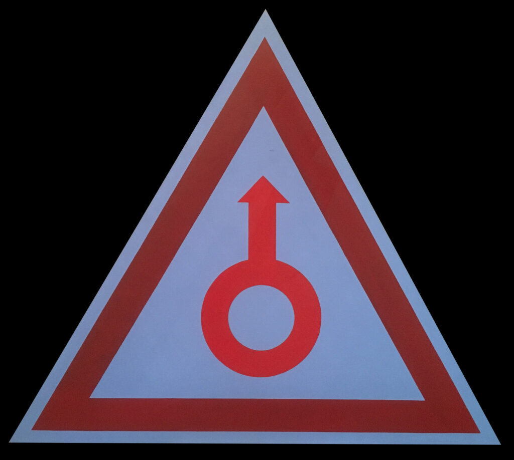 un symbole dans une forme triangulaire
