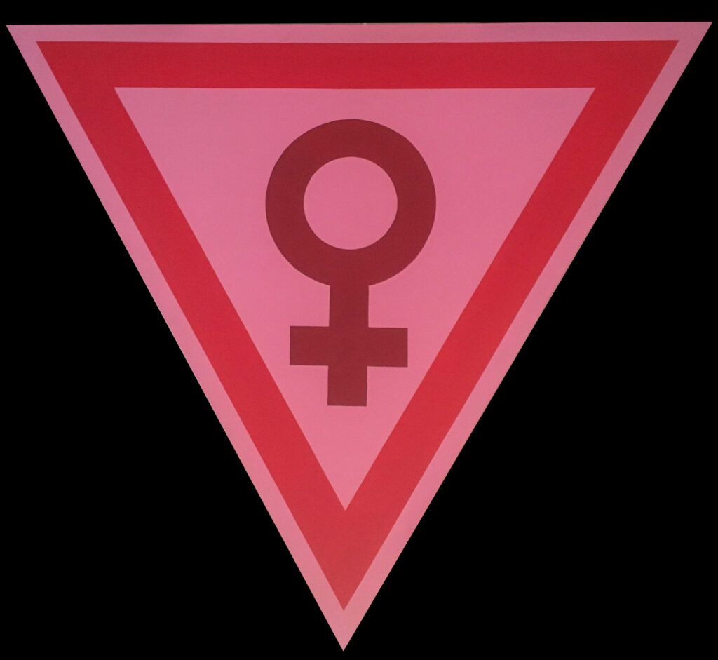 un symbole dans une forme triangulaire